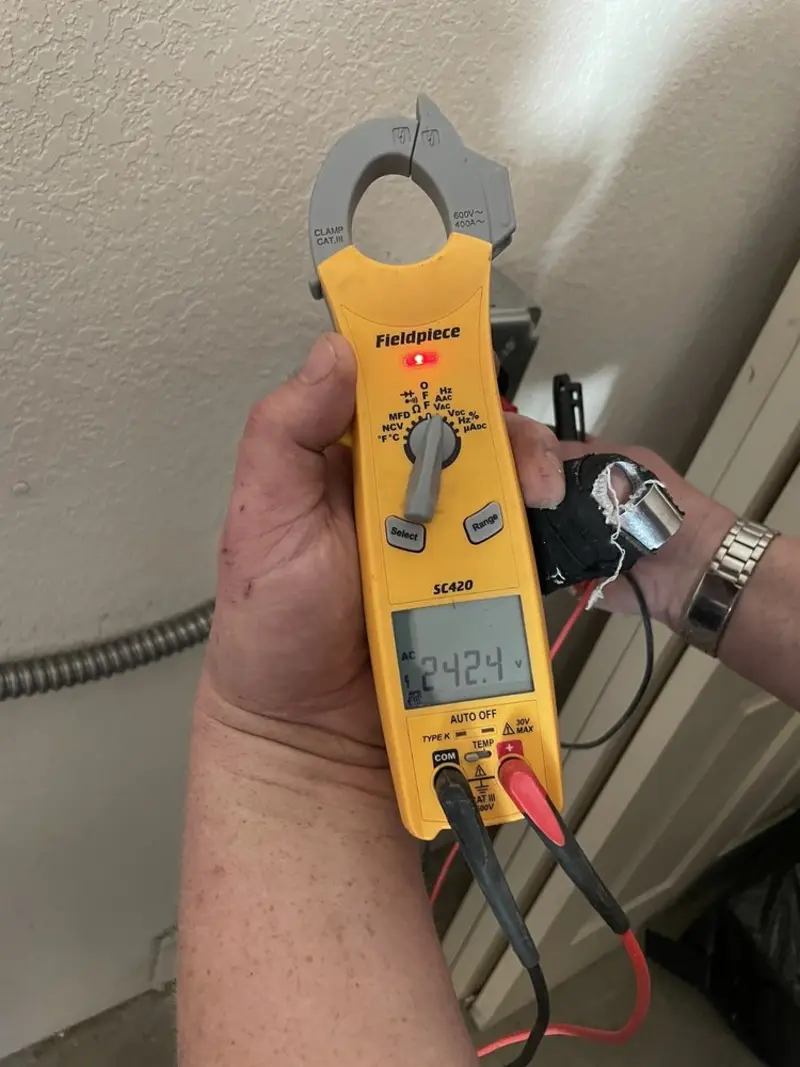 Voltage testing with clamp meter during Circuit Breaker Repair in South Barrington
